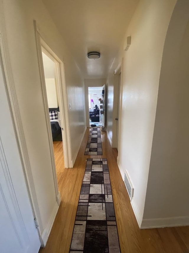 3300 N Osage Ave, Chicago, IL 60634 - hall with visible vents, wood finished floors, and baseboards
