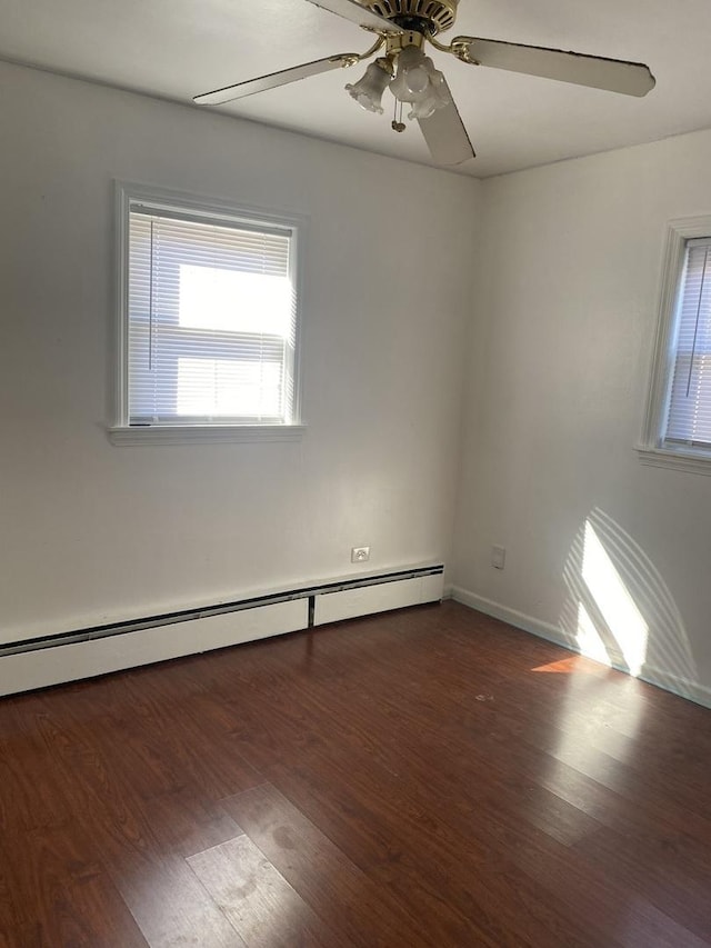 3300 N Osage Ave, Chicago, IL 60634 - empty room with a baseboard heating unit, a ceiling fan, and wood finished floors