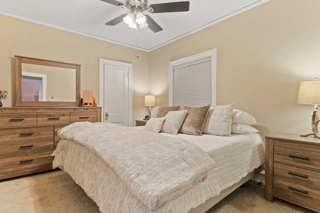 bedroom featuring light carpet, a ceiling fan, and crown molding