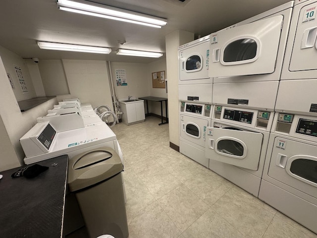 shared laundry area featuring washer and dryer and stacked washing maching and dryer