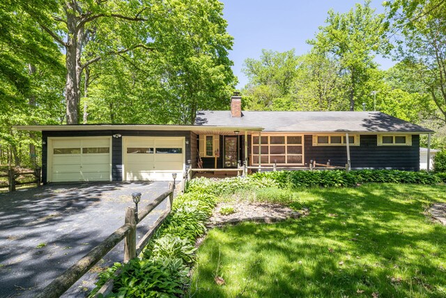 11040 W Cleveland Rd, Mokena, IL 60448 - single story home with asphalt driveway, a garage, a chimney, and a front lawn