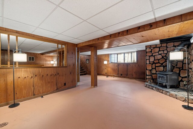 11040 W Cleveland Rd, Mokena, IL 60448 - basement with wooden walls, a drop ceiling, stairway, and a wood stove
