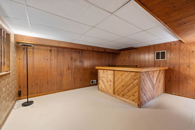 11040 W Cleveland Rd, Mokena, IL 60448 - indoor dry bar featuring wooden walls, a paneled ceiling, and concrete flooring