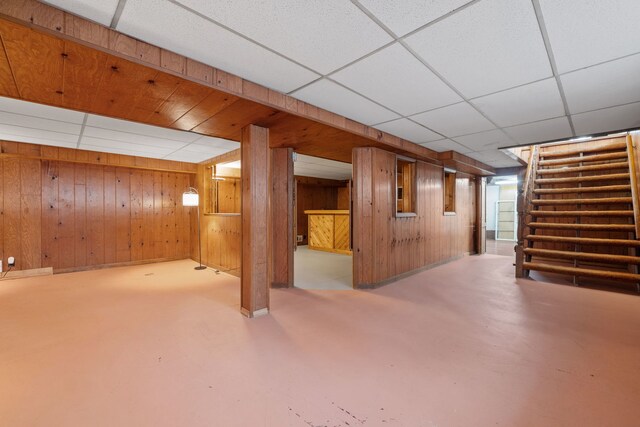 11040 W Cleveland Rd, Mokena, IL 60448 - finished basement with a paneled ceiling, stairs, and wood walls