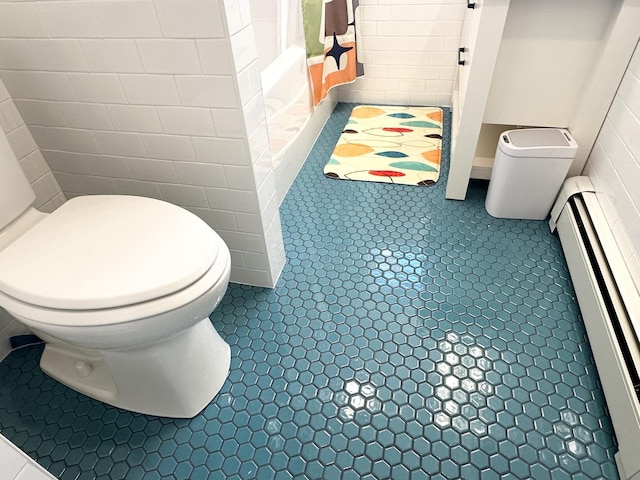 bathroom featuring toilet, a baseboard radiator, and tile patterned flooring