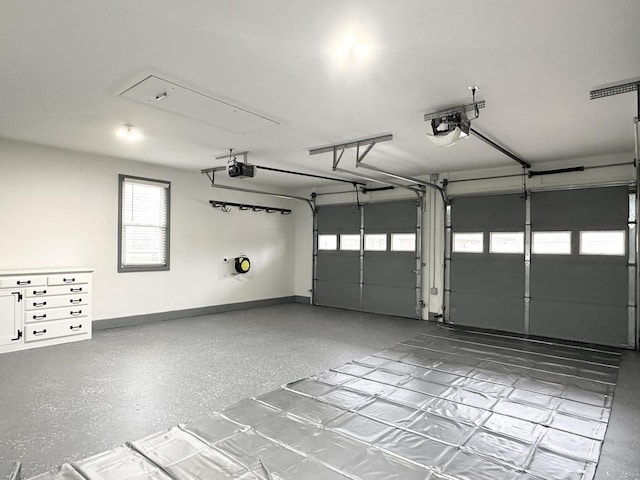 garage featuring baseboards and a garage door opener