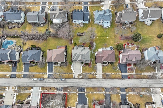 birds eye view of property with a residential view