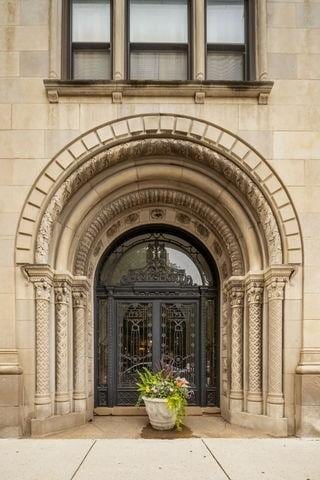 view of exterior entry with stone siding