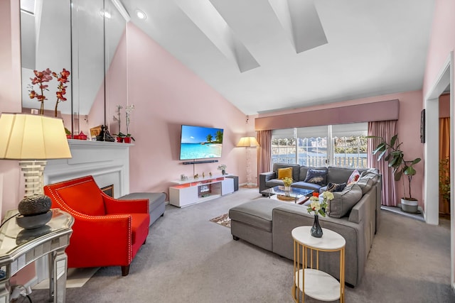 carpeted living area with high vaulted ceiling