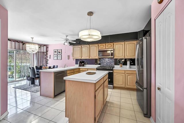 kitchen featuring stainless steel appliances, light tile patterned flooring, light countertops, a center island, and decorative backsplash