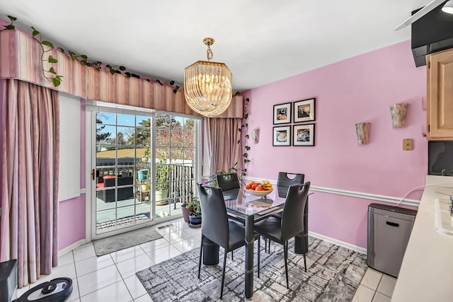dining space with an inviting chandelier, visible vents, baseboards, and light tile patterned flooring