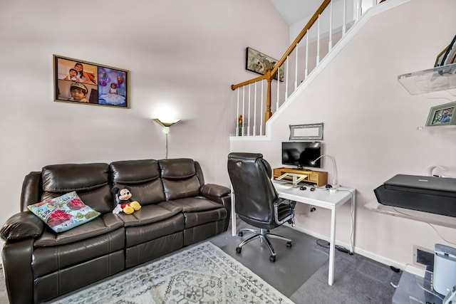 office space featuring vaulted ceiling and baseboards