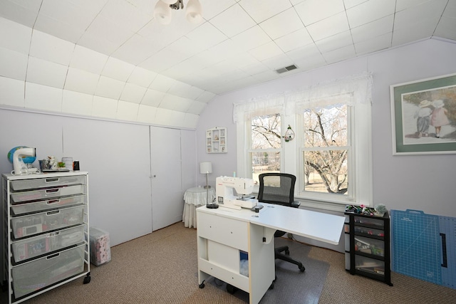 office with visible vents, carpet, and vaulted ceiling