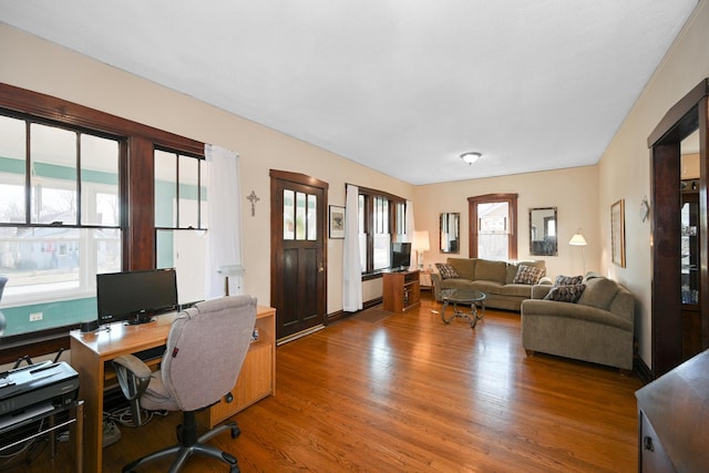 home office with wood finished floors