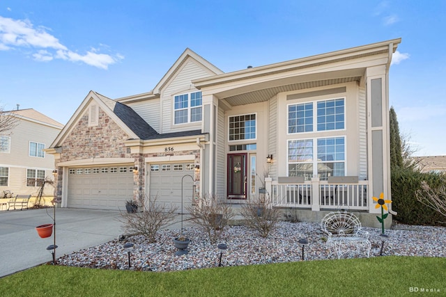 view of front facade featuring a porch, stone siding, driveway, and an attached garage