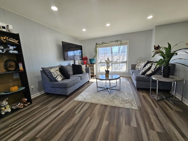 living area featuring baseboards, dark wood finished floors, and recessed lighting