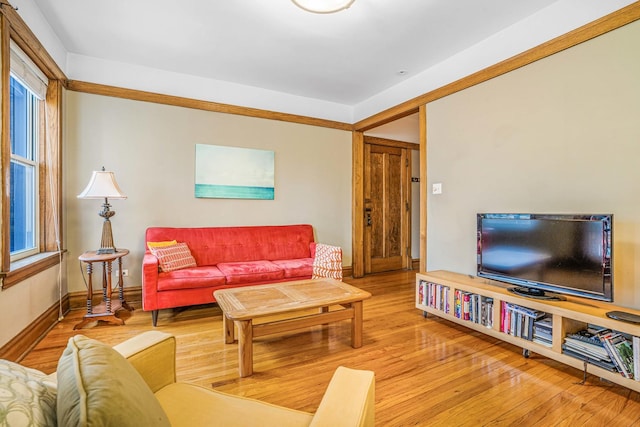 living area with wood finished floors and baseboards