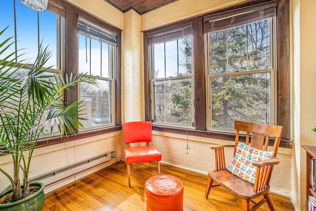 sunroom featuring baseboard heating