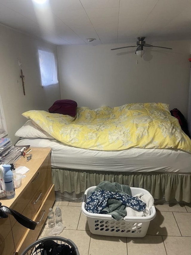 bedroom featuring light tile patterned floors and a ceiling fan