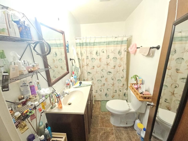 full bathroom featuring a shower with shower curtain, vanity, toilet, and tile patterned floors