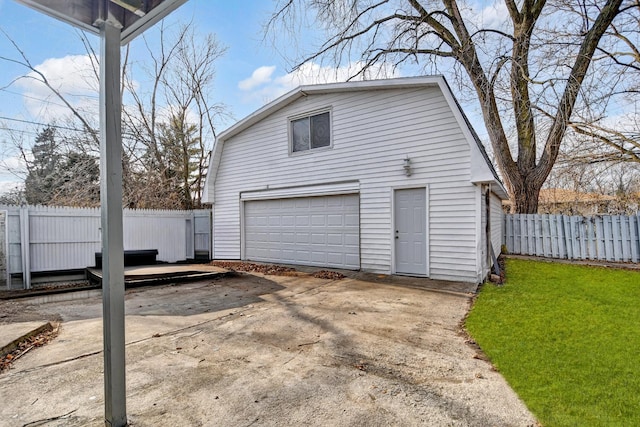 garage with a garage and fence