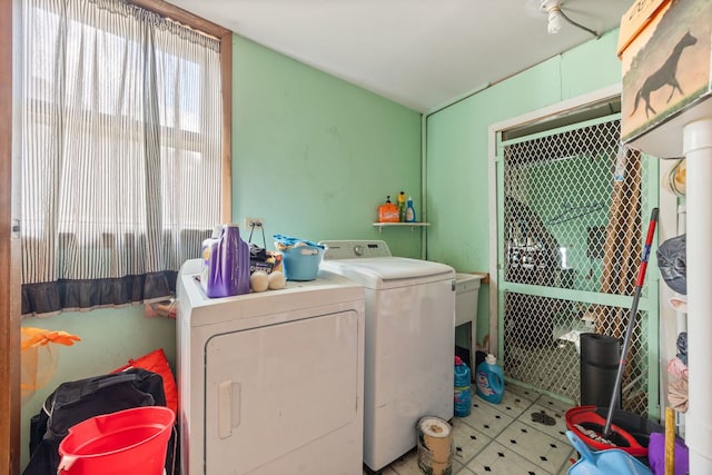 washroom featuring laundry area and separate washer and dryer