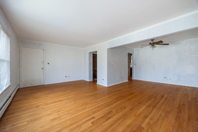 unfurnished living room with a baseboard heating unit, ceiling fan, baseboards, and light wood-style floors