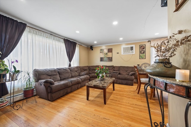 living area featuring light wood-style floors, recessed lighting, a wall unit AC, and crown molding