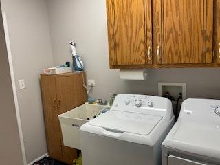 laundry area with cabinet space and washing machine and dryer