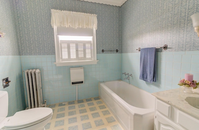 bathroom with radiator, wallpapered walls, toilet, and a bath