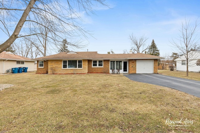 single story home featuring aphalt driveway, brick siding, a chimney, and an attached garage