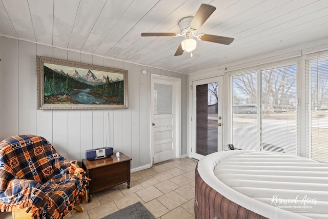 bedroom featuring access to exterior, a ceiling fan, wooden ceiling, and light tile patterned floors