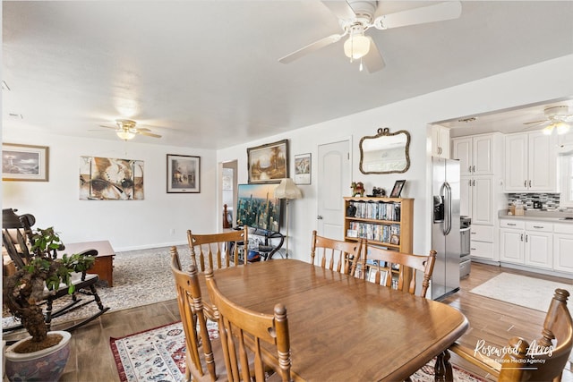 dining space featuring a ceiling fan and light wood-type flooring