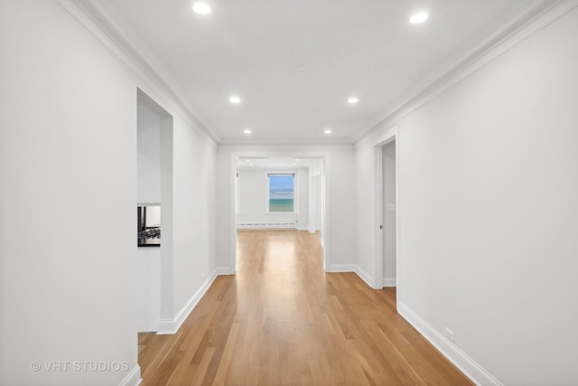 corridor featuring light wood-style floors, baseboards, crown molding, and recessed lighting