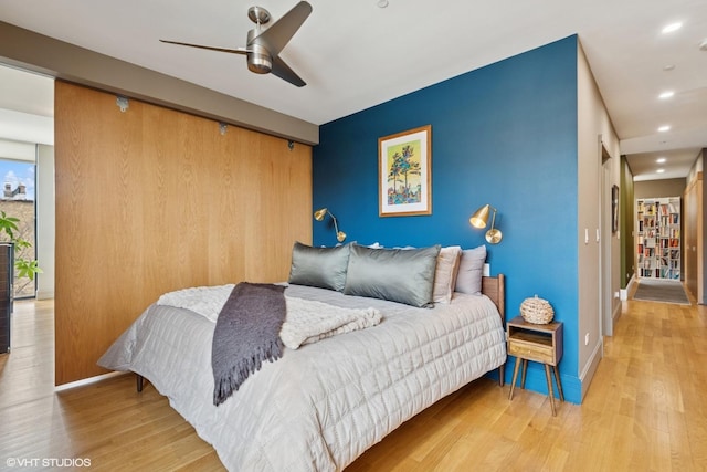 bedroom with baseboards, ceiling fan, recessed lighting, and light wood-style floors