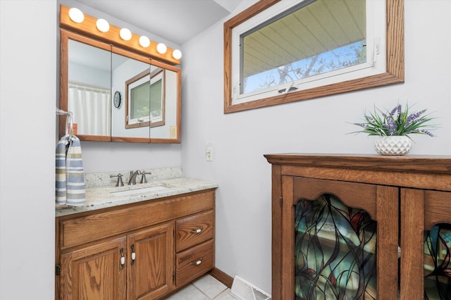 bathroom with vanity, tile patterned flooring, and visible vents