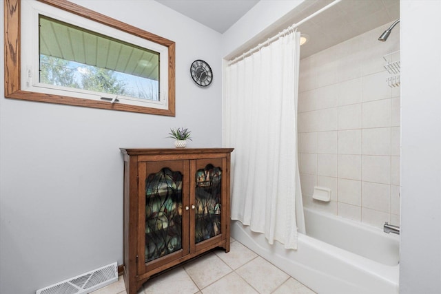 bathroom featuring visible vents, tile patterned floors, and shower / bath combo