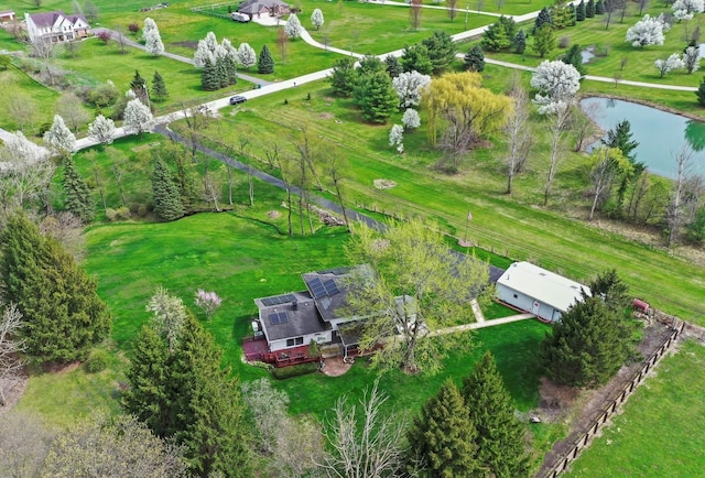 birds eye view of property with a water view and a rural view