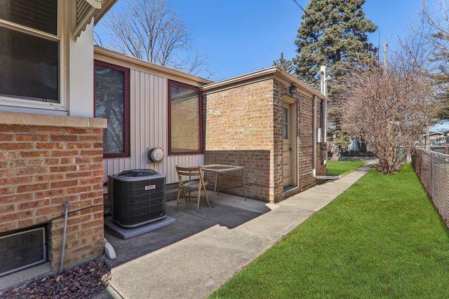 exterior space featuring cooling unit and fence