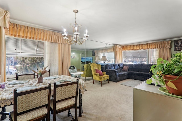 carpeted dining area featuring a chandelier