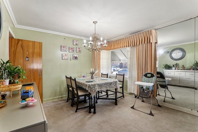 dining space featuring carpet floors, ornamental molding, baseboards, and an inviting chandelier