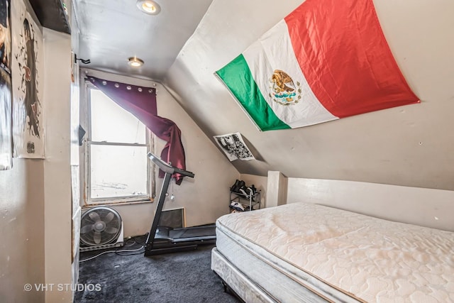 bedroom featuring lofted ceiling and carpet flooring