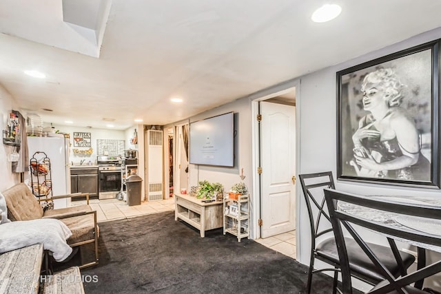 interior space featuring recessed lighting and light tile patterned flooring