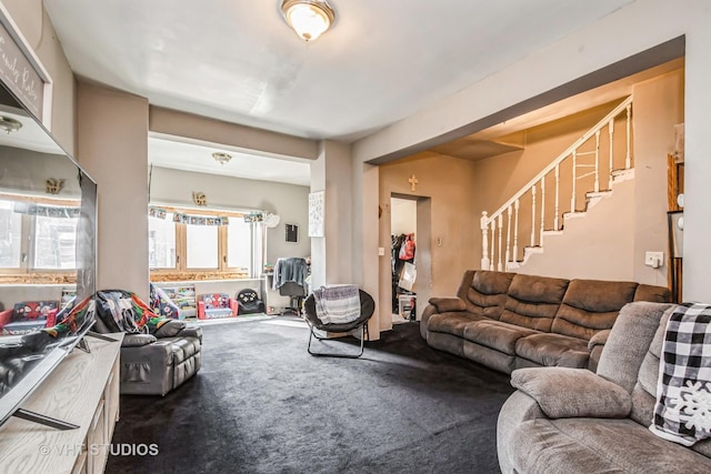 carpeted living room with stairway