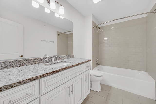 full bathroom with toilet, tile patterned flooring, washtub / shower combination, and vanity