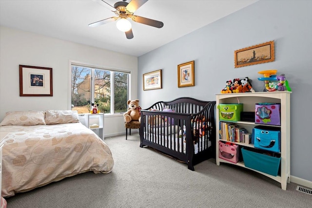 bedroom with carpet floors, baseboards, and a ceiling fan