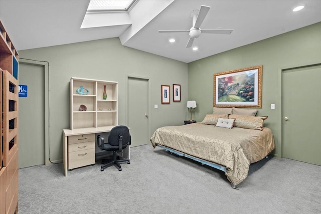 bedroom featuring light carpet, ceiling fan, lofted ceiling with skylight, and recessed lighting