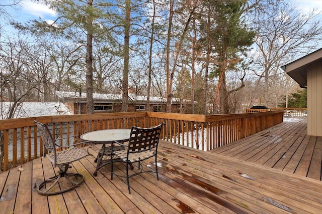 wooden deck with outdoor dining space