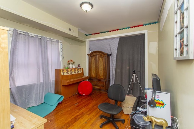 interior space featuring visible vents and wood finished floors