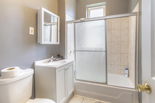 full bath with toilet, tile patterned floors, enclosed tub / shower combo, and vanity